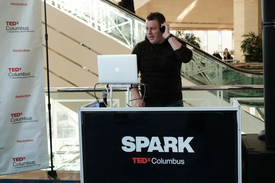 DJ booth wrapped in SPARK branding